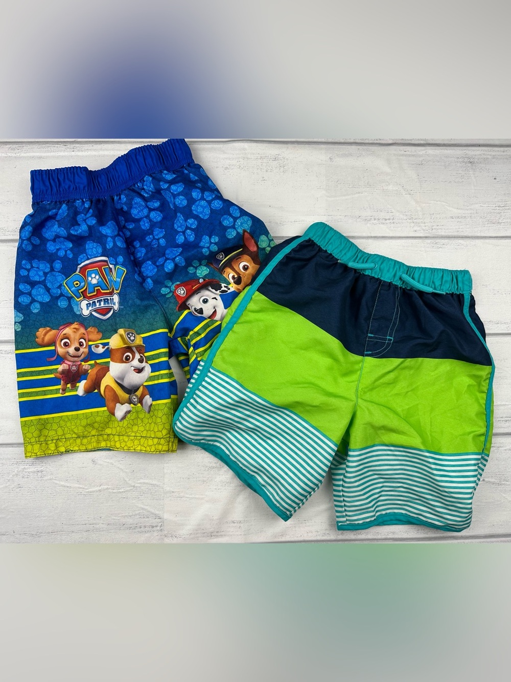 Two pairs of boys size 5t swim trunks